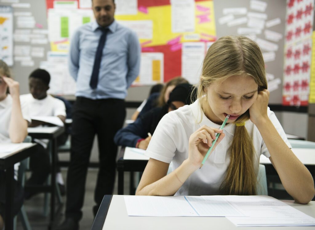 Students doing the exam in classroom